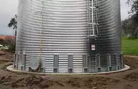 Corrugated steel tank installed on a concrete pad