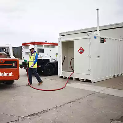 EnviroCube Fuel Tank being used to refuel a piece of contruction equipment.