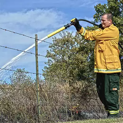 Foam Ranger Man Holding Hose Spraying